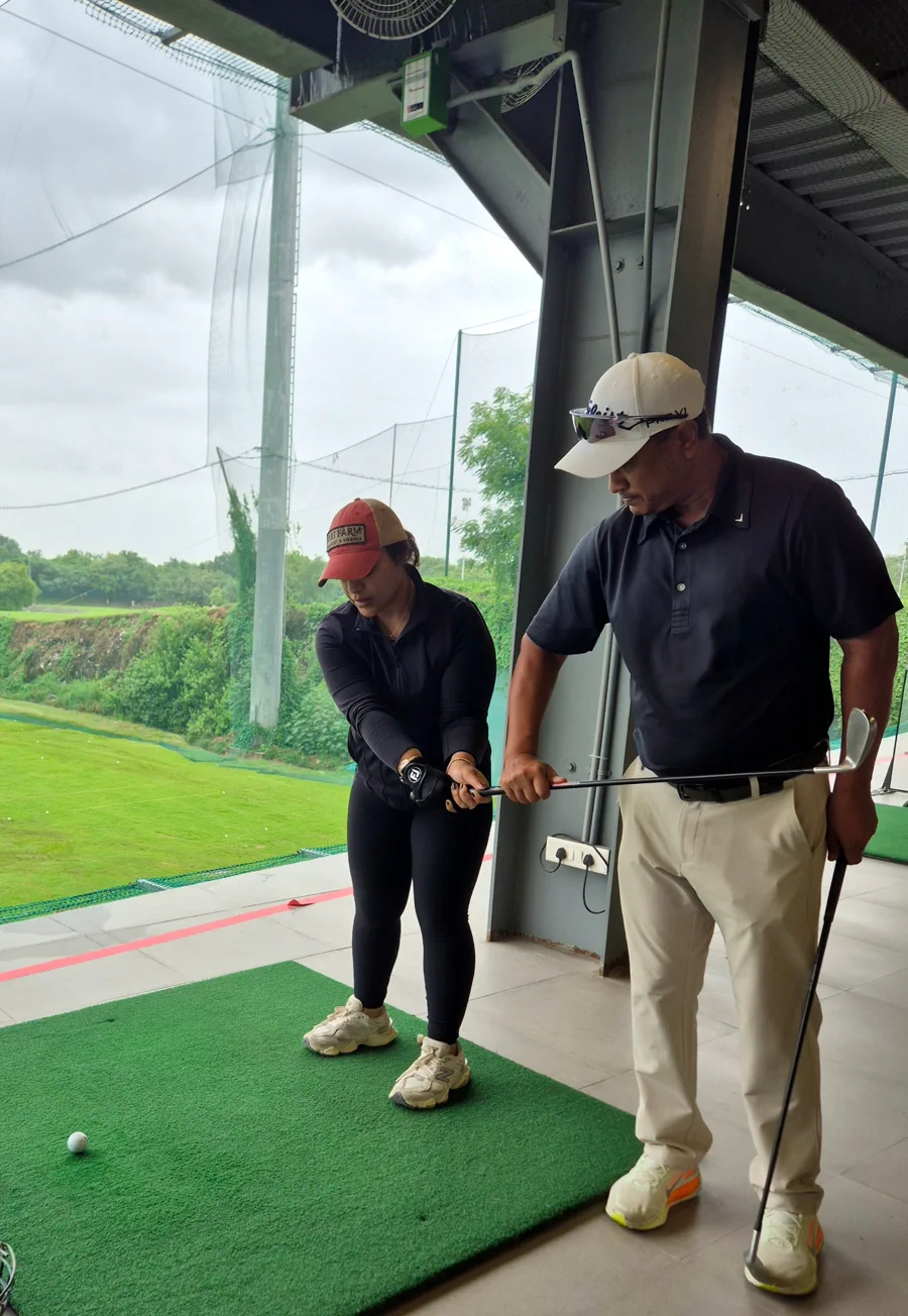Amit Khaitan demonstrating grip and setup during an individual golf lesson